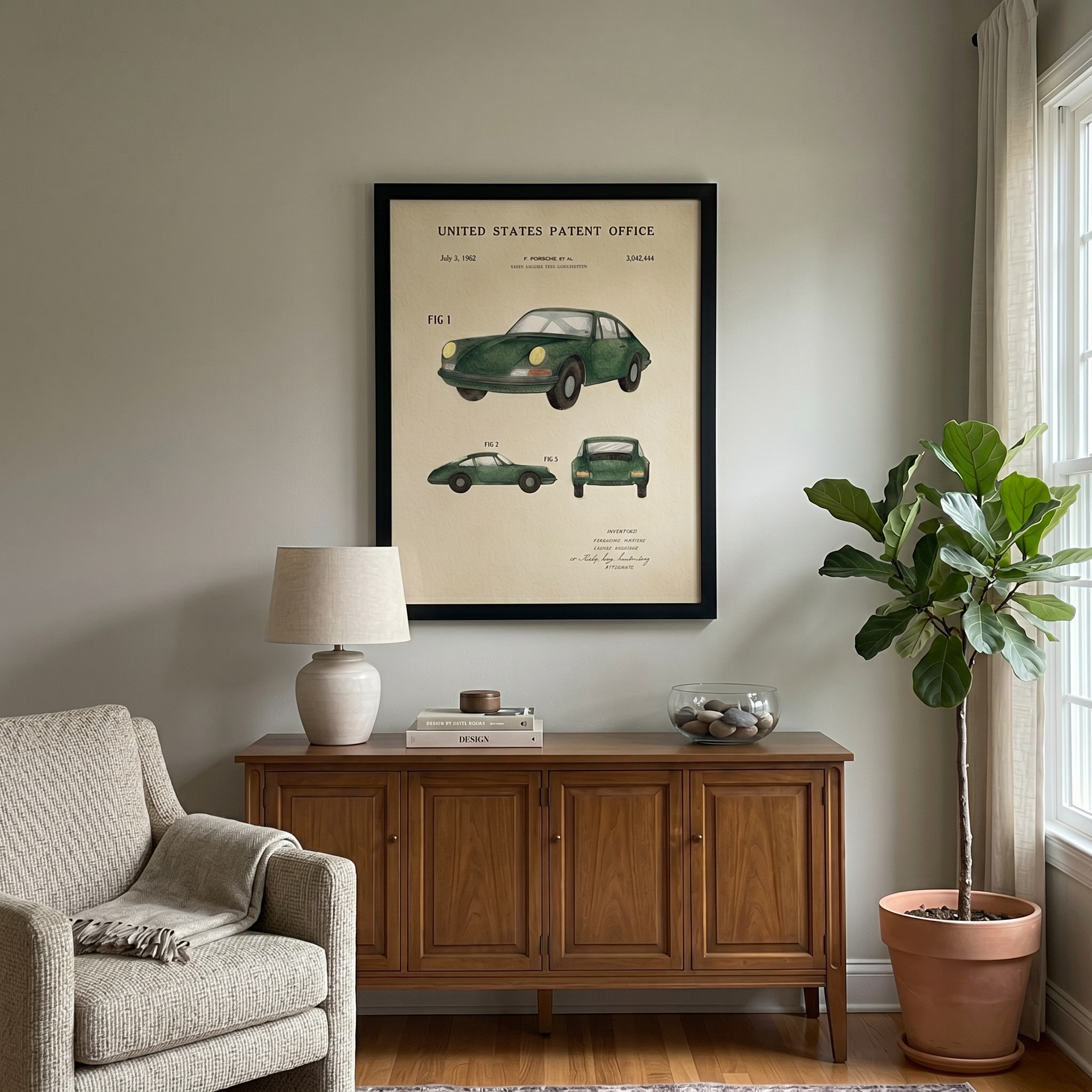 Dad hanging a framed patent art print in his home office